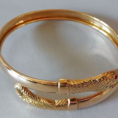 Gouden slangen -klemarmband	