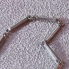 Lange zilveren ketting met staafjes schakels